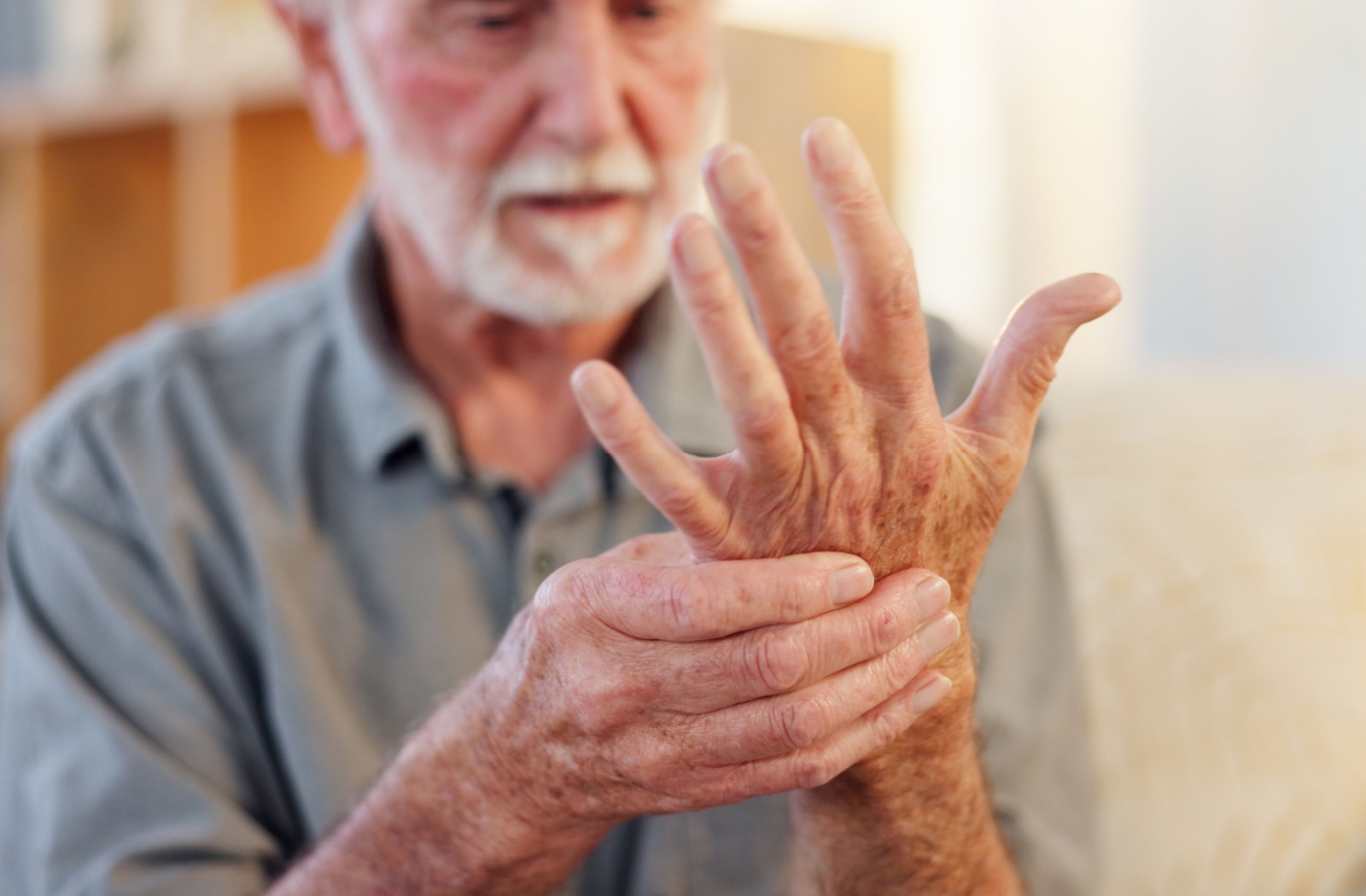 senior checking on their hand